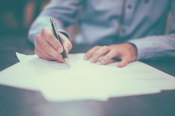 handle sexual harassment paper and pen